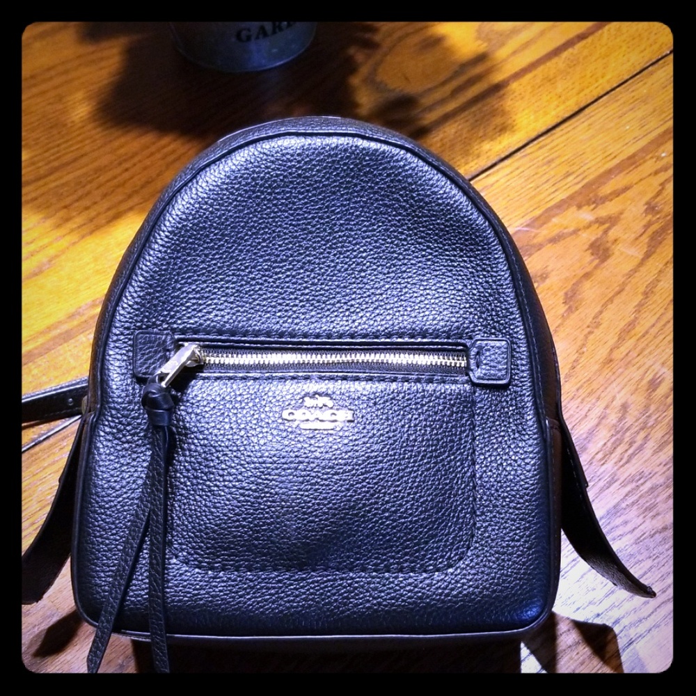 Coach black backpack can convert to cross body